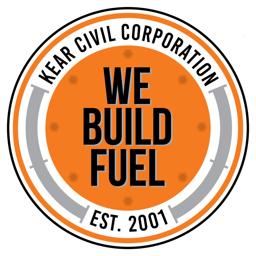 A bold graphic with white text stating "we build energy" inside an orange circle, surrounded by a stylized gray circular track design on a black background.
