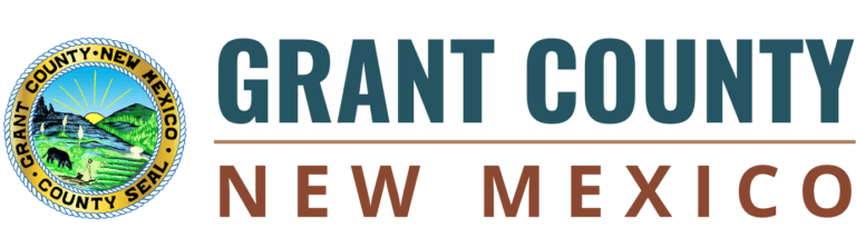 Logo of grant county, new mexico featuring a green landscape, rising sun, blue text with the county's name and website, and a symbol for fuel projects.